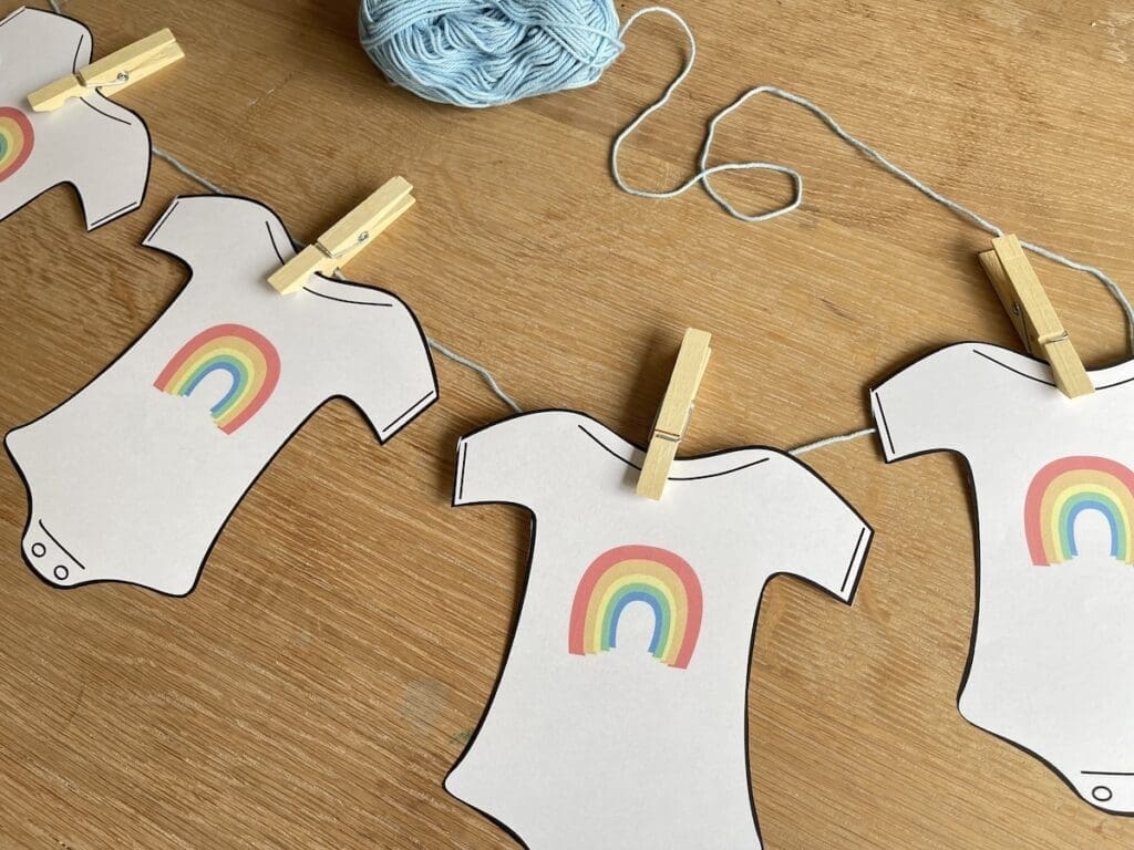regenboog thema babyshower slinger